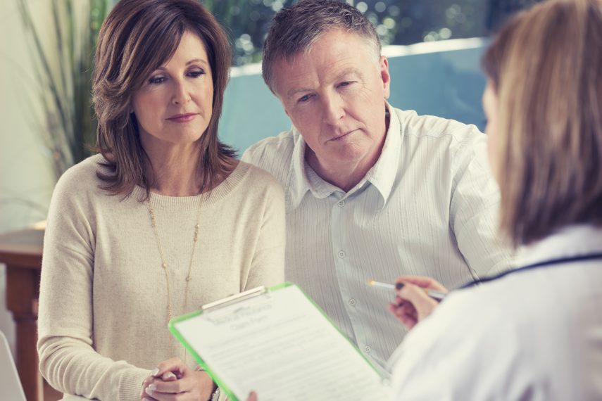 Mature couple with doctor.